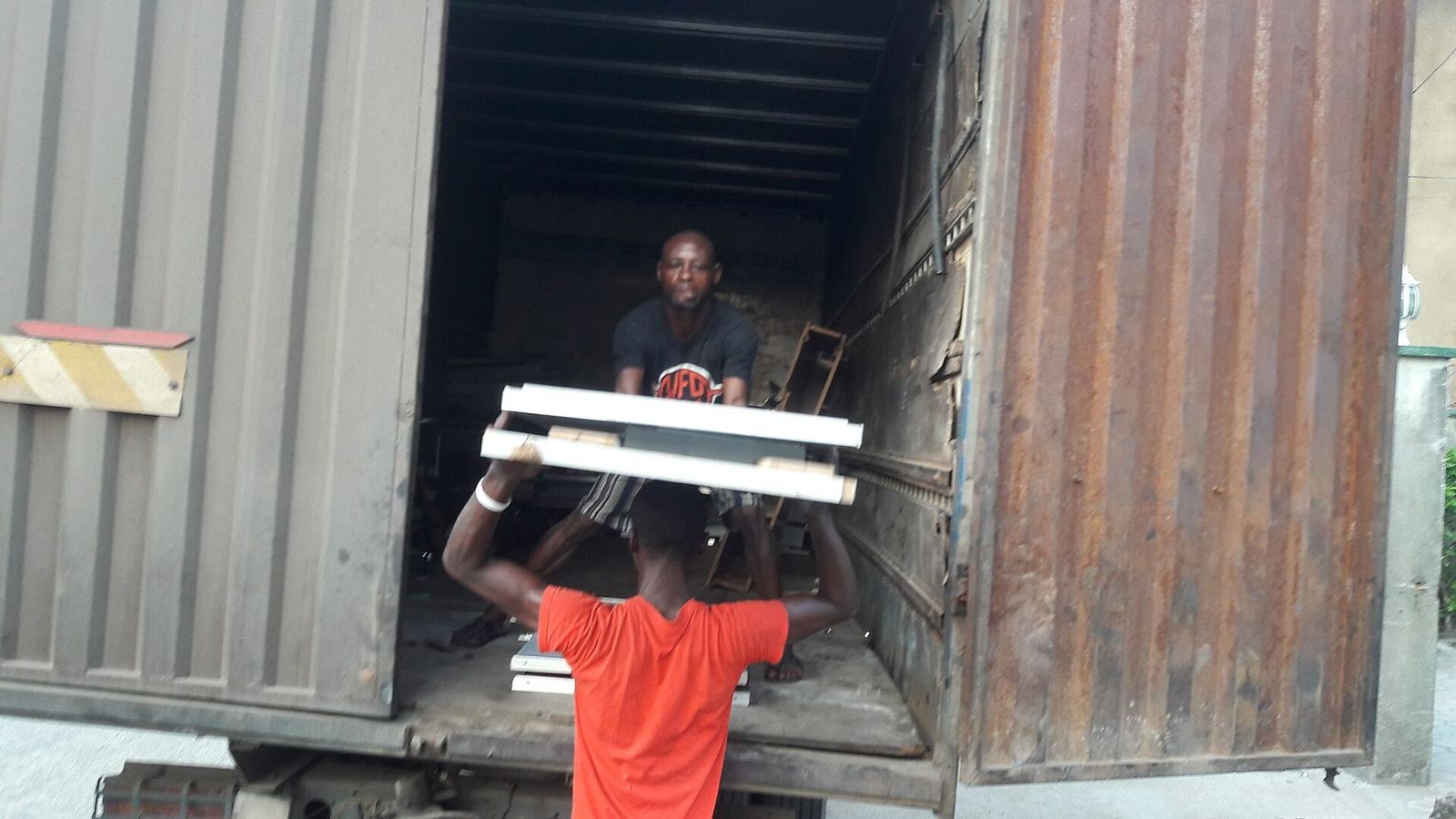 Freight being loaded onto a truck for onward transport