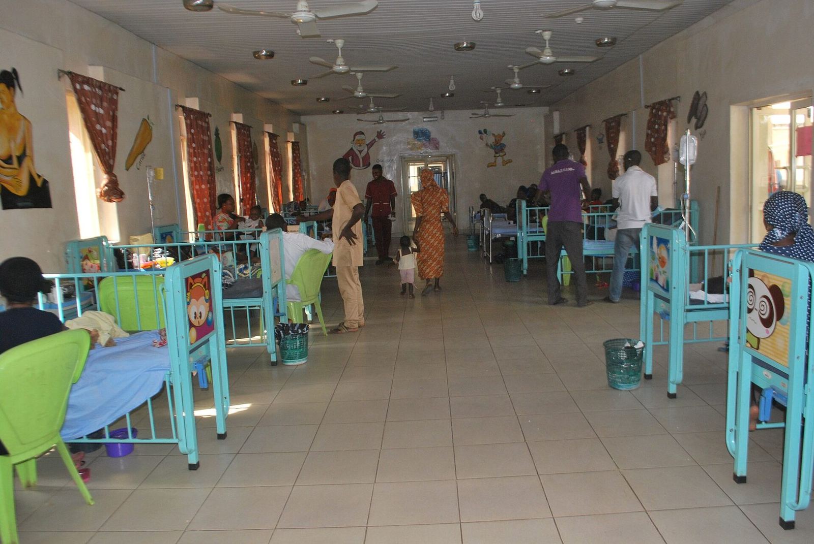 A hospital ward and a city aerial in fragile and conflict-affected settings